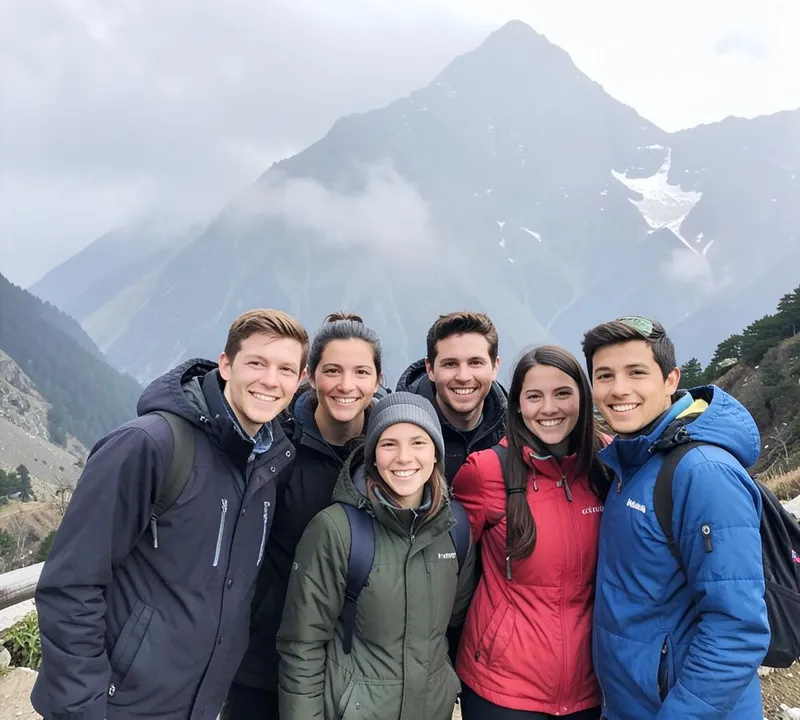 Travel group smiling at a mountain viewpoint